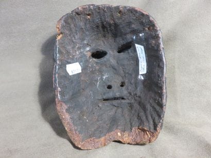 Shamanic mask of oval shape. Wood with brown...