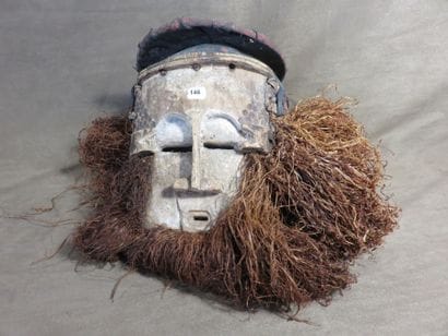 Dance mask. The face is inscribed in a rectangle,...