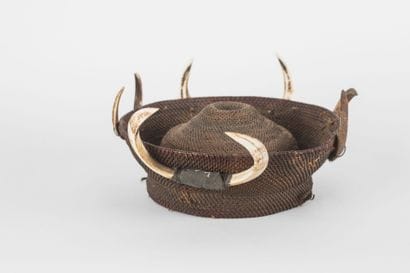 Round warrior headdress, surrounded by four...