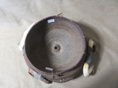 Round warrior headdress, surrounded by four...