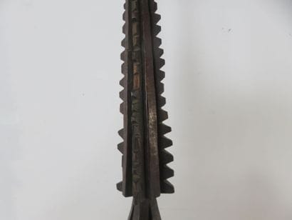 Long war spear with multiple protruding barbs...