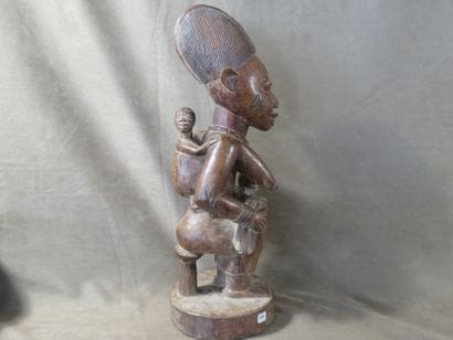 Maternity represented sitting on a stool,...