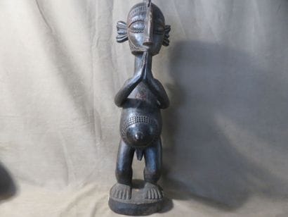 Male statue representing a B'mba (nimba)...