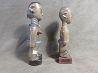 Two fetishes represented standing with their...