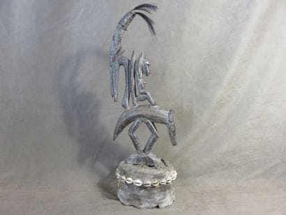 Tyi-Wara. Crest mask resting on its dance...
