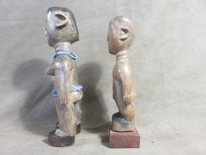 Two fetishes represented standing with their...