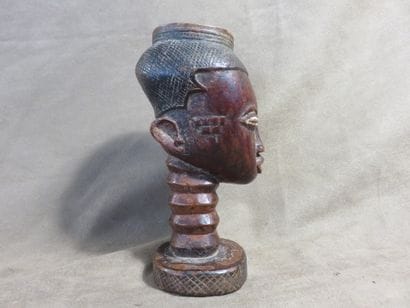 Palm wine cup representing a human head....