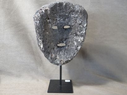 Mask with human face. Fossilized coral. Height:...