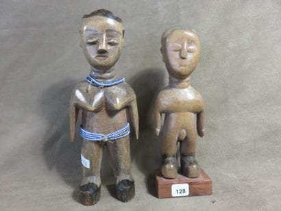 Two fetishes represented standing with their...