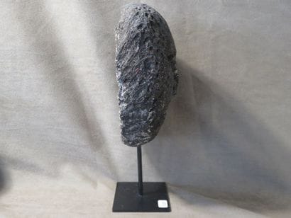 Mask with human face. Fossilized coral. Height:...