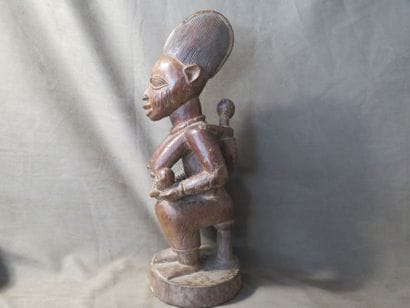 Maternity represented sitting on a stool,...