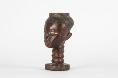 Palm wine cup representing a human head....