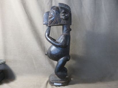 Male statue representing a B'mba (nimba)...