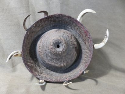 Round warrior headdress, surrounded by four...