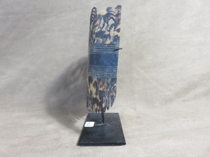 Headdress ornament. Representation in the...