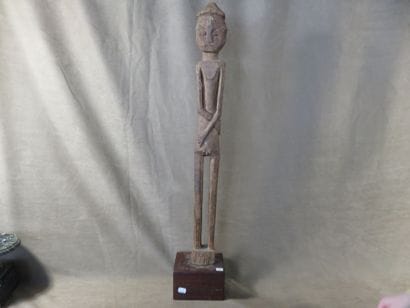 Character represented standing with his arms...