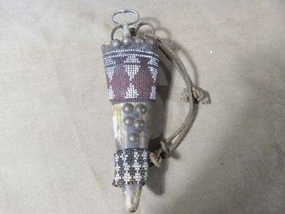 Mohara talisman horn, partially covered with...
