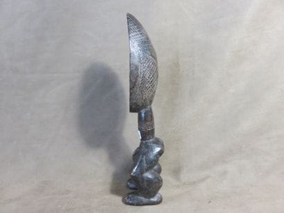 Spoon. The spoon is carried by two legs,...