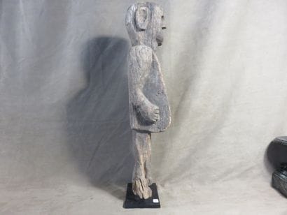 Fetish represented standing. Wood with light...
