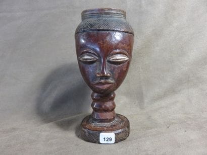 Palm wine cup representing a human head....