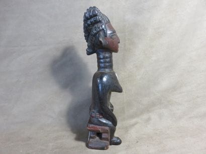 Female fetish represented sitting on a stool,...