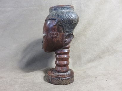 Palm wine cup representing a human head....