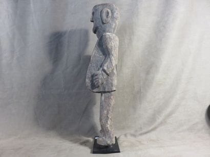 Fetish represented standing. Wood with light...