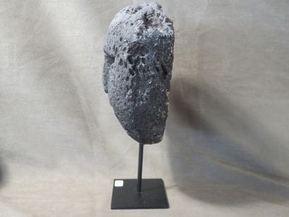 Mask with human face. Fossilized coral. Height:...
