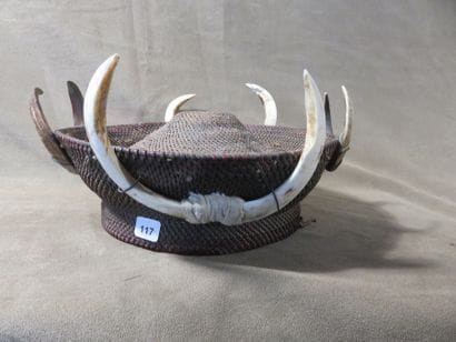 Round warrior headdress, surrounded by four...