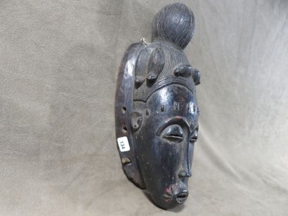 Ndoma portrait mask with idealized face....