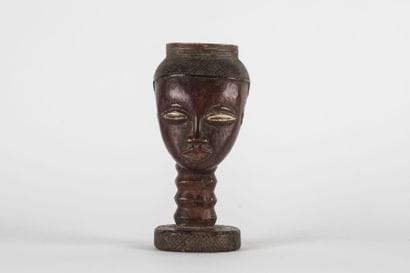Palm wine cup representing a human head....