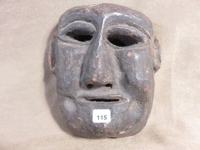 Shamanic mask of oval shape. Wood with brown...