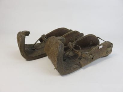 Pair of sandals. Polychrome carved leather....