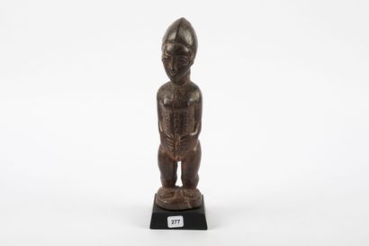 Male ancestor standing with both hands on...