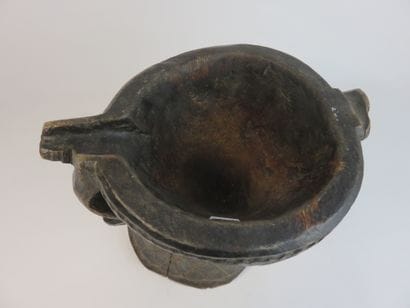 Heavy wooden mortar with a patina of use....