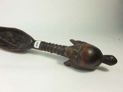 Spoon. The handle, fluted, is surmounted...