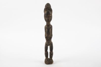 Male ancestor standing with both hands on...