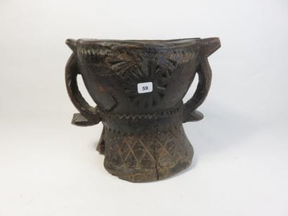 Heavy wooden mortar with a patina of use....