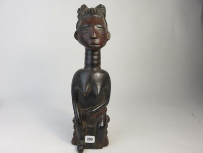 Female fetish represented sitting on a stool,...