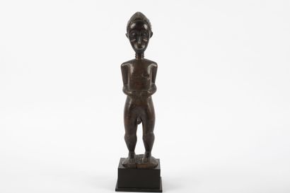 Male ancestor standing with both hands on...