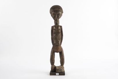Male ancestor standing with both hands on...