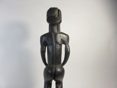 Pole top representing a male Byeri. He is...