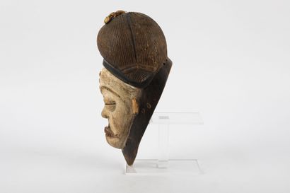 Okuyi dance mask representing an idealized...