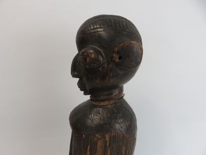 Small slotted drum used by diviners. It is...