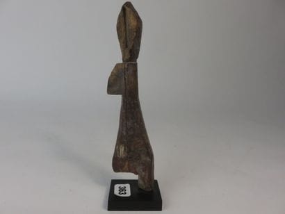 Little one-legged medicine doll. Wood with...