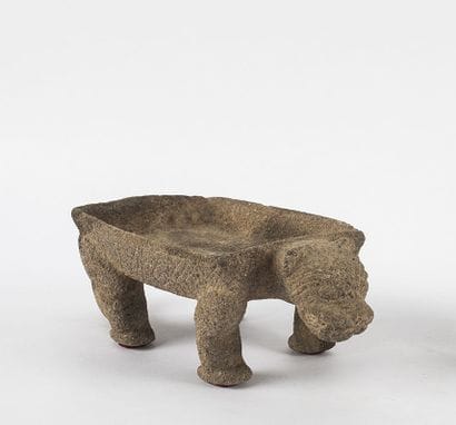 Metate. Grinding table representing a jaguar....