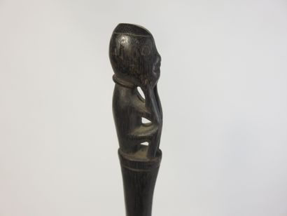 Tun-tun. It is surmounted by a small squatting...