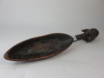 Spoon. The handle, fluted, is surmounted...