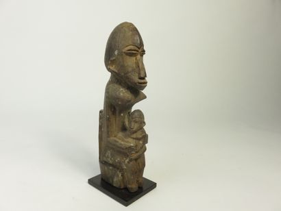 Maternity seated on a high-backed throne,...