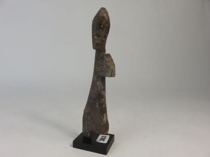 Little one-legged medicine doll. Wood with...